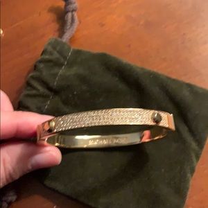 Michael Kors rose gold bangle with pave stones.